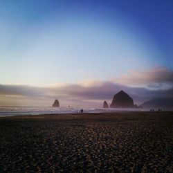 Scenic view of beach at sunset