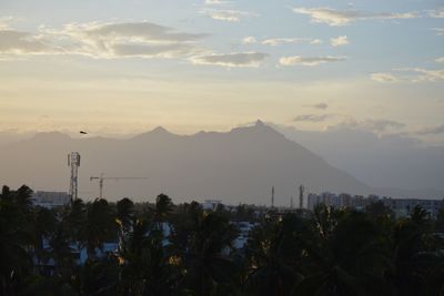 Scenic view of silhouette mountains against sky at sunset