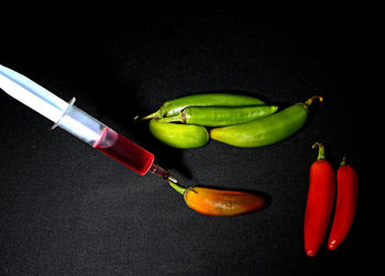 High angle view of green chili peppers on table