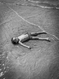 High angle view of man swimming in sea