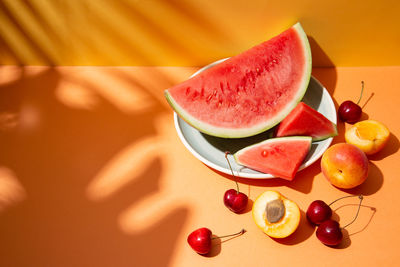 High angle view of fruits in plate on table