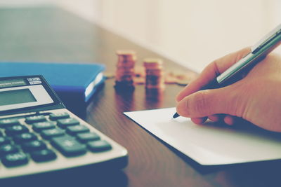 Close-up of human hand on table