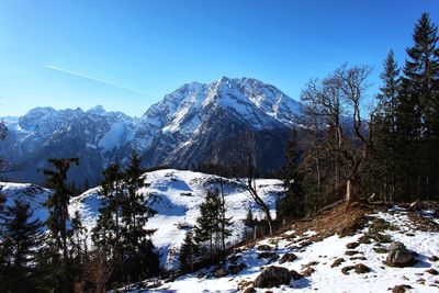 Scenic view of snowcapped mountains against clear sky