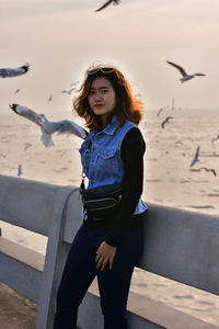 Young woman standing on beach