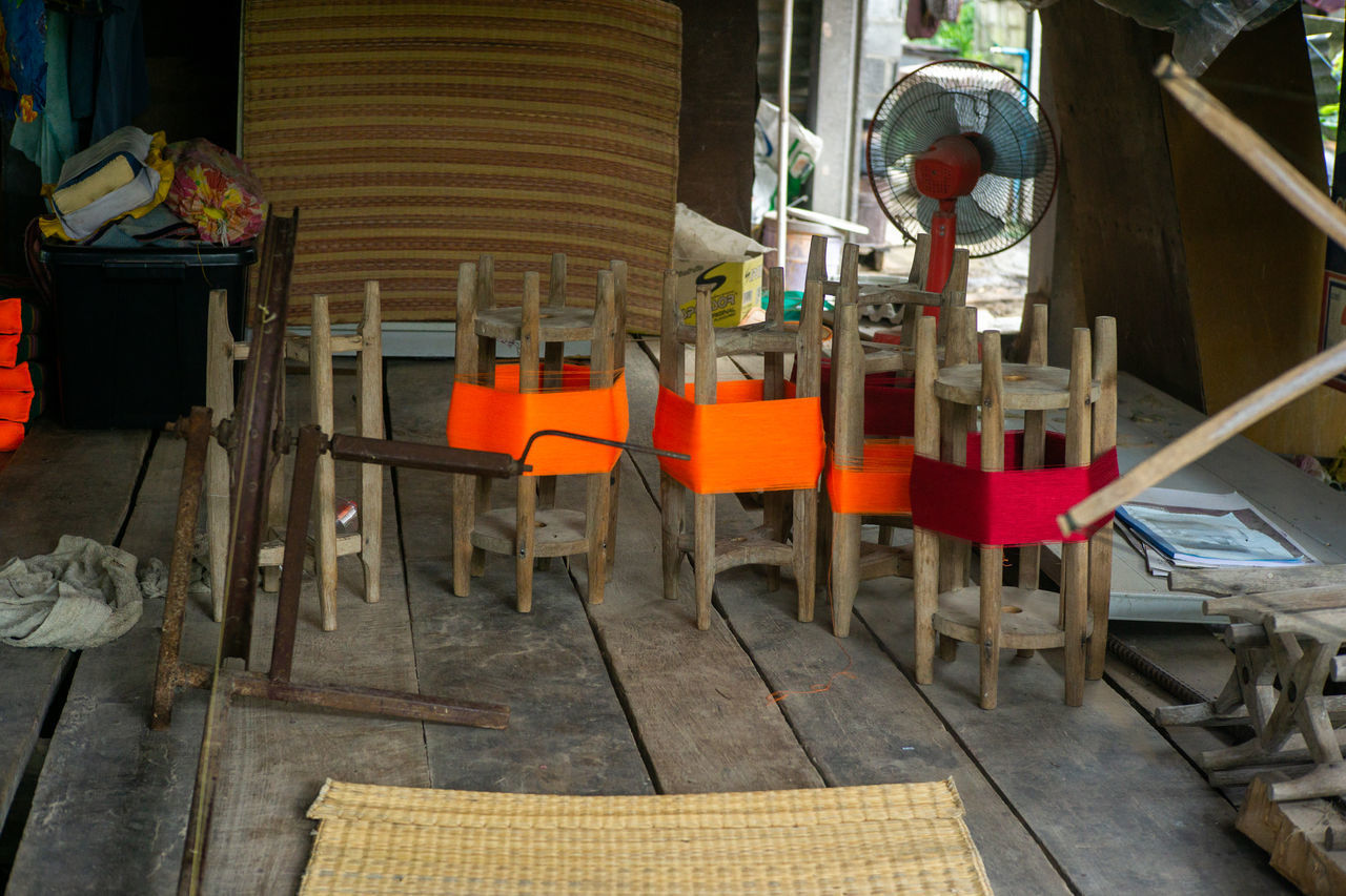 CLOSE-UP OF CHAIRS AND TABLES IN ROW