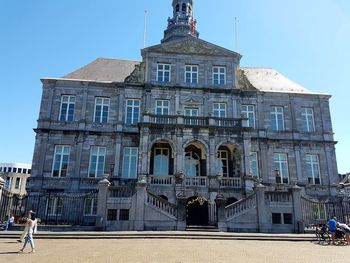 Low angle view of building against blue sky