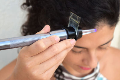 Close-up portrait of man holding hands