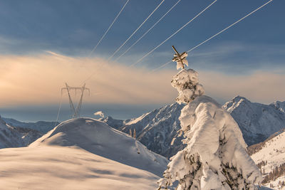 Scenic view of snowcapped mountain against sky during sunset