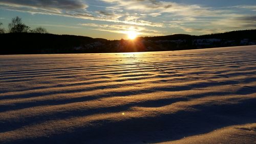 Scenic view of landscape against sky during sunset