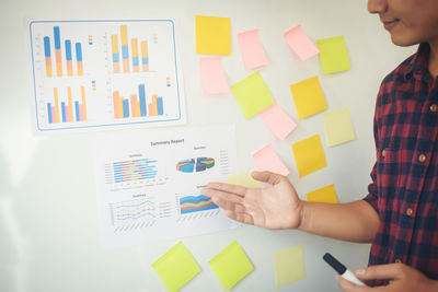 Close-up of businessman pointing at graph 