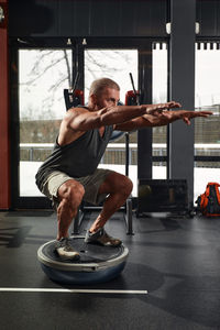 Man exercising in gym