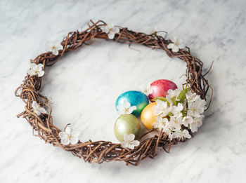 High angle view of eggs in nest on table