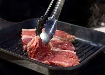 Close-up of meat on barbecue grill