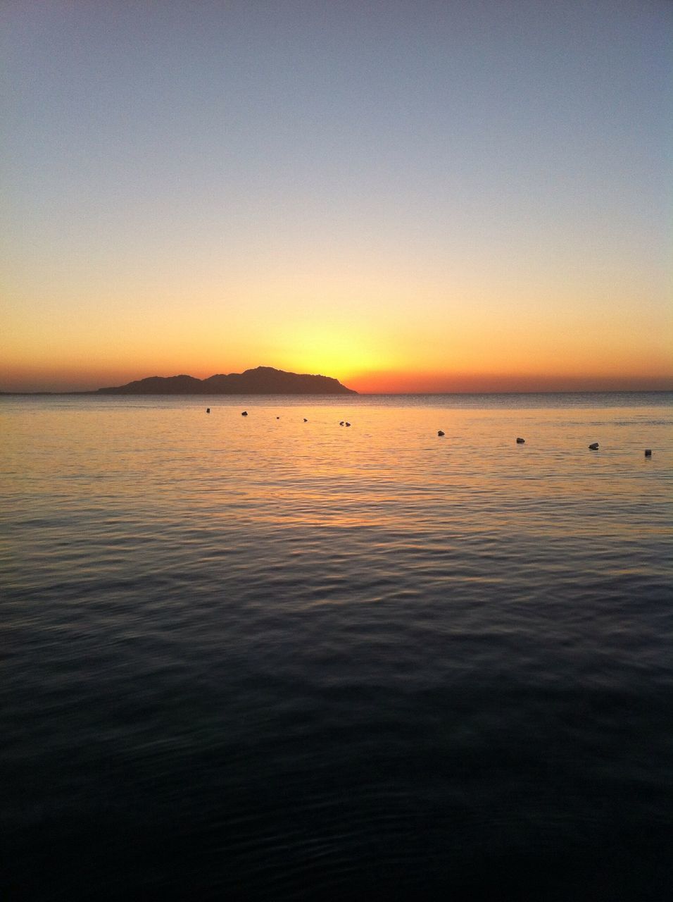 water, sea, sunset, scenics, waterfront, tranquil scene, copy space, clear sky, horizon over water, tranquility, beauty in nature, orange color, idyllic, rippled, nature, silhouette, seascape, sky, dusk, outdoors