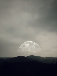 Scenic view of moon against sky at night