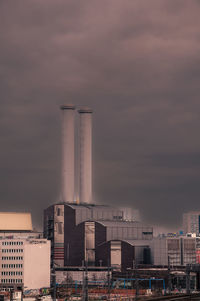 Buildings in city against sky during sunset