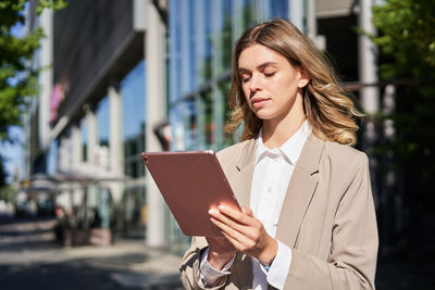 Young woman using mobile phone