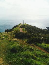 Scenic view of hill against sky