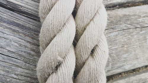 Close-up high angle view of rope on wood