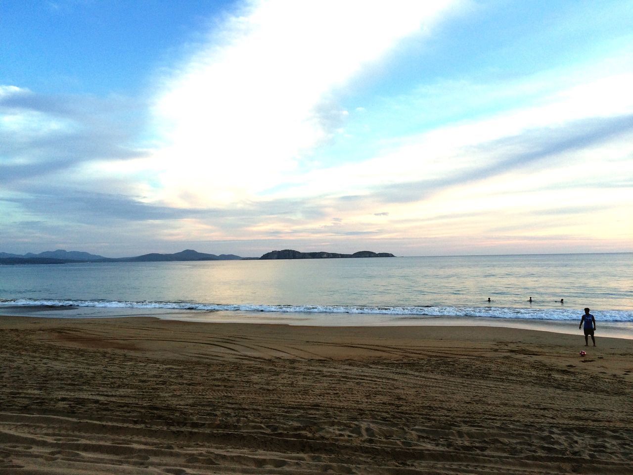 beach, sea, water, sky, shore, sand, horizon over water, scenics, tranquil scene, tranquility, cloud - sky, leisure activity, beauty in nature, lifestyles, vacations, nature, cloud, idyllic, incidental people