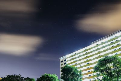 Low angle view of built structure against sky at night