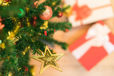 High angle view of gifts by christmas tree