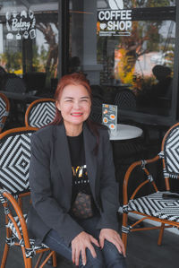 Woman sitting in restaurant at cafe