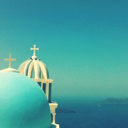 Cross against clear blue sky