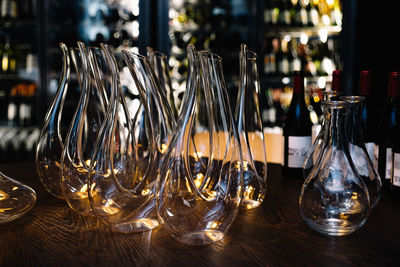 Empty clean wine decanters on the table in the darkroom decanters are prepared before wine served