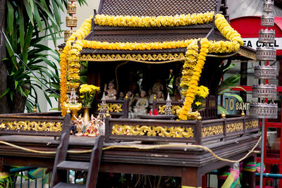 Statue of a temple against building