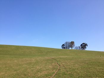 Scenic view of land against clear blue sky