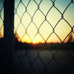 Chainlink fence seen through chainlink fence