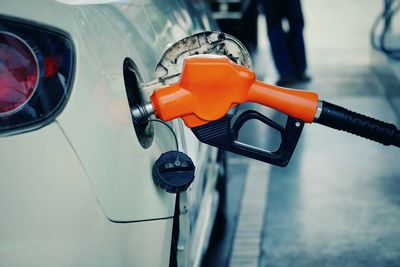 Close-up of refueling car at fuel pump