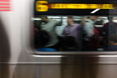 Blurred motion of train at railroad station