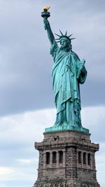 Low angle view of statue against sky