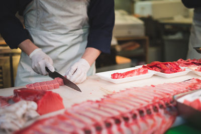 Midsection of man preparing food