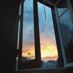 Low angle view of sky seen through window