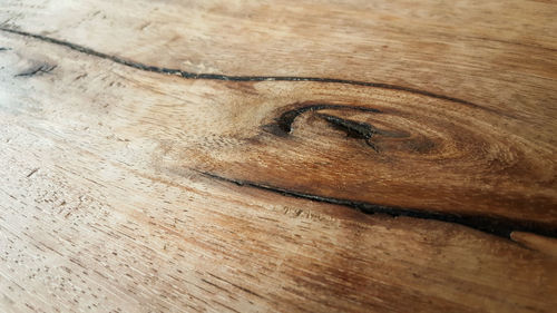 Close-up of hole on wooden table