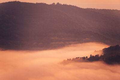 Scenic view of cloudscape against orange sky