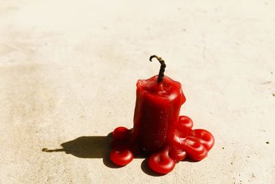 Close-up of red chili peppers on table