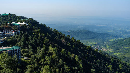 Scenic view of tree mountains against sky