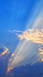 Low angle view of clouds in sky at sunset