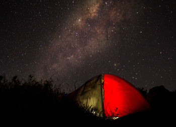 Low angle view of tent against sky at night