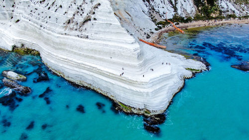 High angle view of rock formation in sea