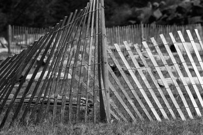 Close-up of wooden fence against sky