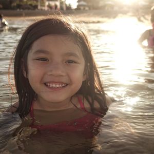 Portrait of smiling girl in swimming pool