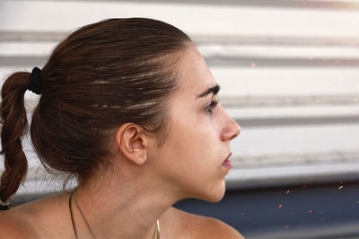 Close-up of young woman looking away