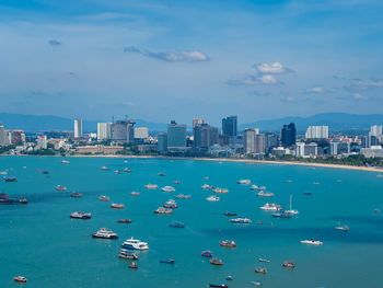 Scenic view of sea and buildings against sky