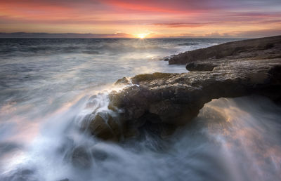 Scenic view of sea against sky during sunset