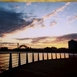 Silhouette of railing at sunset